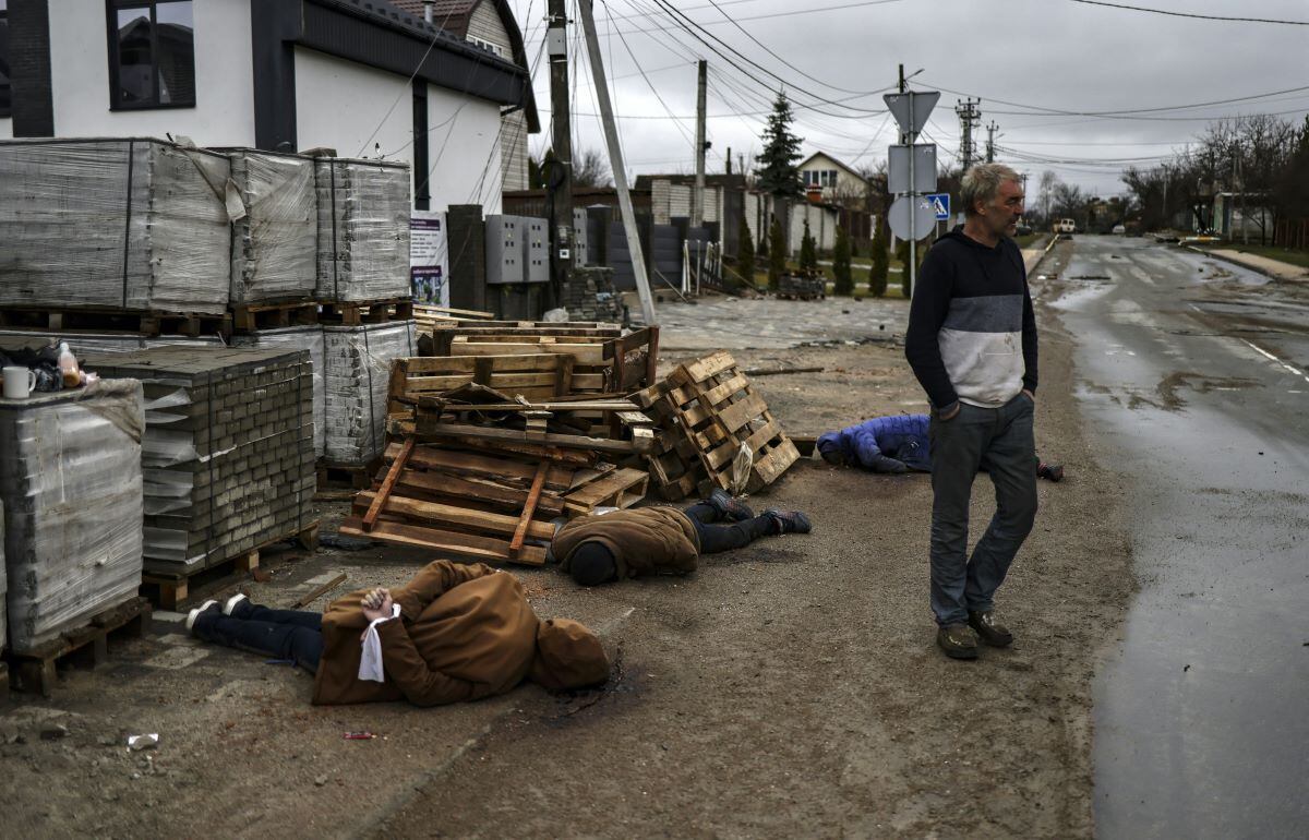 The bodies lie on a street in Bucha, northwest of kyiv, with their hands torn off.  (RONALDO SCHEMIDT / AFP).