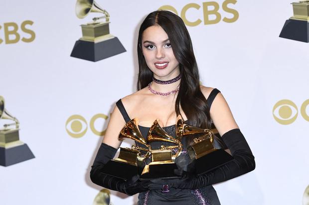 Olivia Rodrigo poses with her awards for Best New Artist, Best Pop Solo Performance and Pop Vocal Album in the press room during the 64th Annual Grammy Awards at the MGM Grand Garden Arena in Las Vegas on April 3, 2022 (Photo : Patrick T. Fallon / AFP)