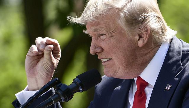 US President Donald Trump announces his decision to withdraw the US from the Paris Climate Accords in the Rose Garden of the White House in Washington, DC, on June 1, 2017.      Trump complained that the deal, which was signed under his predecessor President Barack Obama, gives other countries an unfair advantage over US industry and destroys American jobs. / AFP / Brendan Smialowski