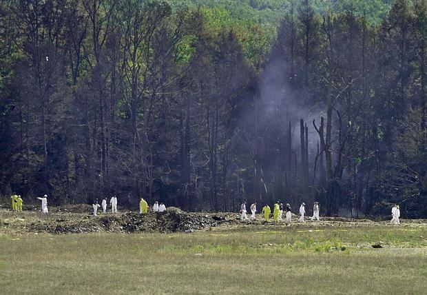 Investigators record the crash site of United Airlines Flight 93 in Shanksville, Pennsylvania. (DAVID MAXWELL / AFP).