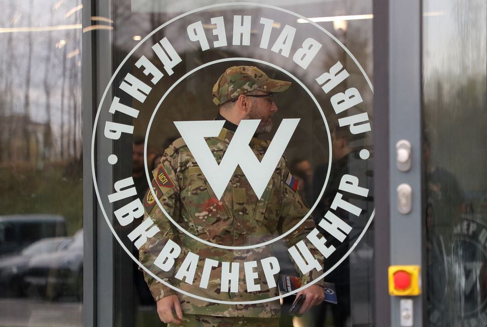 A man dressed in a camouflage uniform leaves the PMC Wagner Center, which is a project implemented by businessman and founder of the private military group Yevgeny Prigozhin.  (REUTERS/Igor Russack)