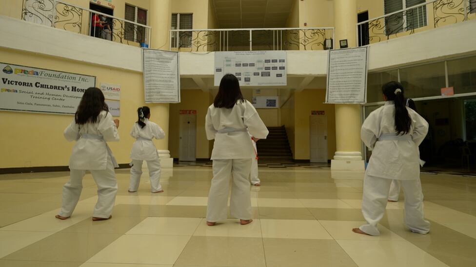 Social workers say routine and sports like karate help children heal.
