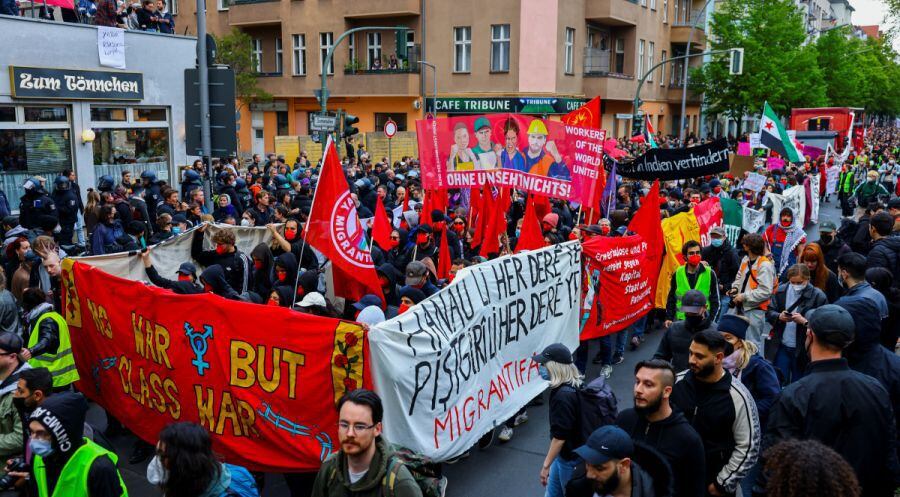 People hold banners as they take part in a May Day demonstration in Berlin, Germany.