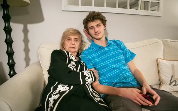 Holocaust survivor Tova Friedman, 85, prepares to record a TikTok video with her grandson, Aron Goodman, 17, in Morristown, New Jersey.  (Ted Shaffrey-AP)