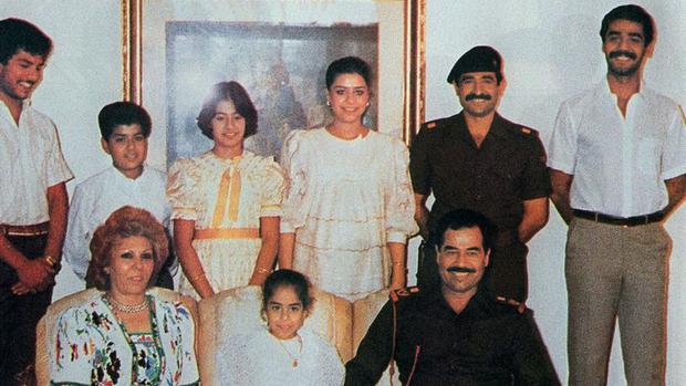 Saddam Hussein and his family in November 1988. (Getty Images).