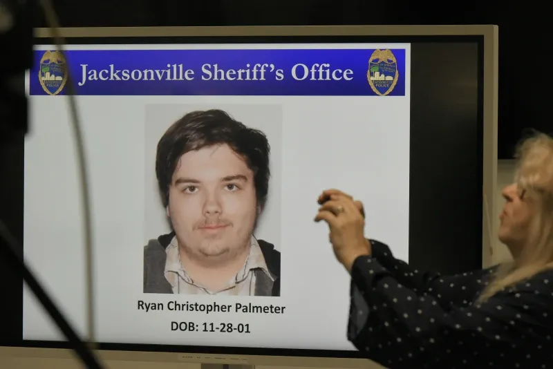 A photograph of shooter Ryan Christopher Palmeter is displayed on a video monitor during Sheriff TK Waters' press conference in Jacksonville, Florida.  (Bob Self/The Florida Times-Union via AP)