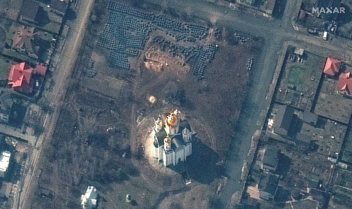 This satellite image from Maxar Technologies from April 3, 2022 shows a view of a mass grave near the Church of Saint Andrew and Pyervozvannoho All Saints in Bucha, Ukraine.  (AFP).