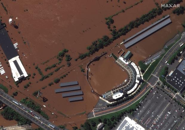 This distributed satellite image released by Maxar Technologies shows that TD Bank's ballpark was flooded in Bridgewater, New Jersey.