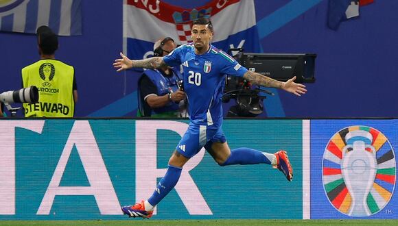Italy's forward #20 Mattia Zaccagni celebrates scoring a goal during the UEFA Euro 2024 Group B football match between Croatia and Italy at the Leipzig Stadium in Leipzig on June 24, 2024. (Photo by Odd ANDERSEN / AFP)