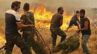 Incendios gigantes dejan al menos un muerto en Grecia