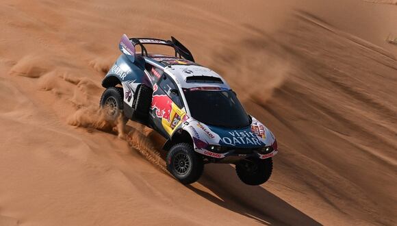 Nasser Racing's Qatari driver Nasser Al-Attiyah and his French co-driver Mathieu Baumel  steer their car during Stage 2 of the Dakar Rally 2024, between Al Henakiyah and Al Duwadimi, Saudi Arabia, on January 7, 2024. (Photo by PATRICK HERTZOG / AFP)