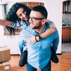 Young couple holding keys of new apartment