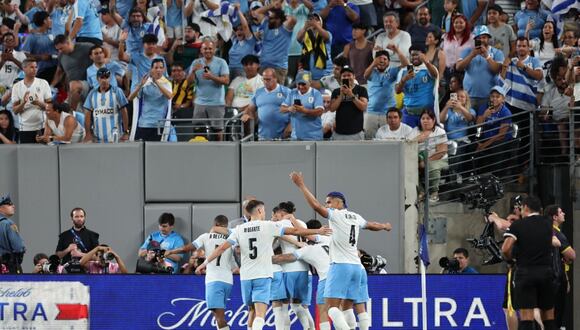 Uruguay's players celebrate after scoring their third goal during the Conmebol 2024 Copa America tournament group C football match between Uruguay and Bolivia at MetLife Stadium in East Rutherford, New Jersey, on June 27, 2024 (Photo by CHARLY TRIBALLEAU / AFP)