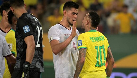 Brazil's forward Neymar (R) argueus with Venezuela's defender Wilker Angel during the 2026 FIFA World Cup South American qualification football match between Brazil and Venezuela at the Arena Pantanal stadium in Cuiaba, Mato Grosso State, Brazil, on October 12, 2023. (Photo by NELSON ALMEIDA / AFP)