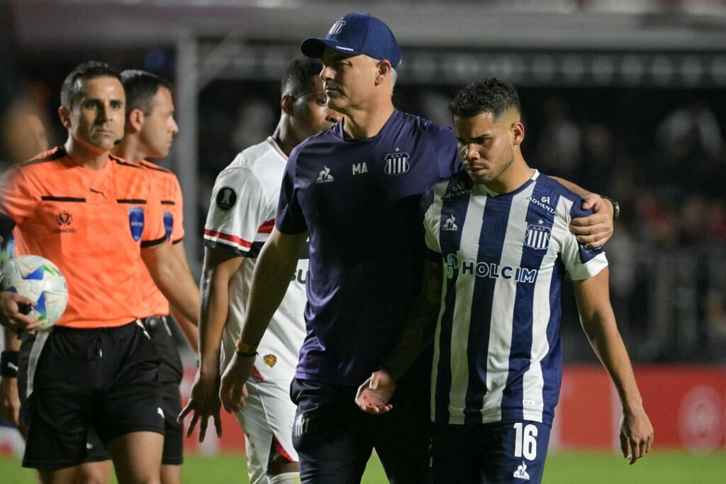 Talleres' Venezuelan defender #16 Miguel Navarro leaves after losing during the Copa Libertadores group stage football match between Brazil's Sao Paulo and Argentina's Talleres at the Morumbi stadium in Sao Paulo, Brazil on May 27, 2025. (Photo by NELSON ALMEIDA / AFP)