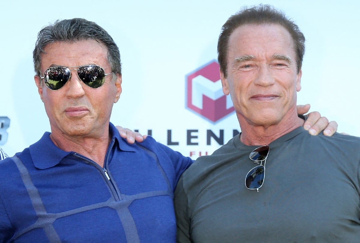 Arnold Schwarzenegger y Sylvester Stallone pasaron de ser rivales acérrimos a socios inesperados gracias a una alianza empresarial. | Crédito: LOIC VENANCE / AFP