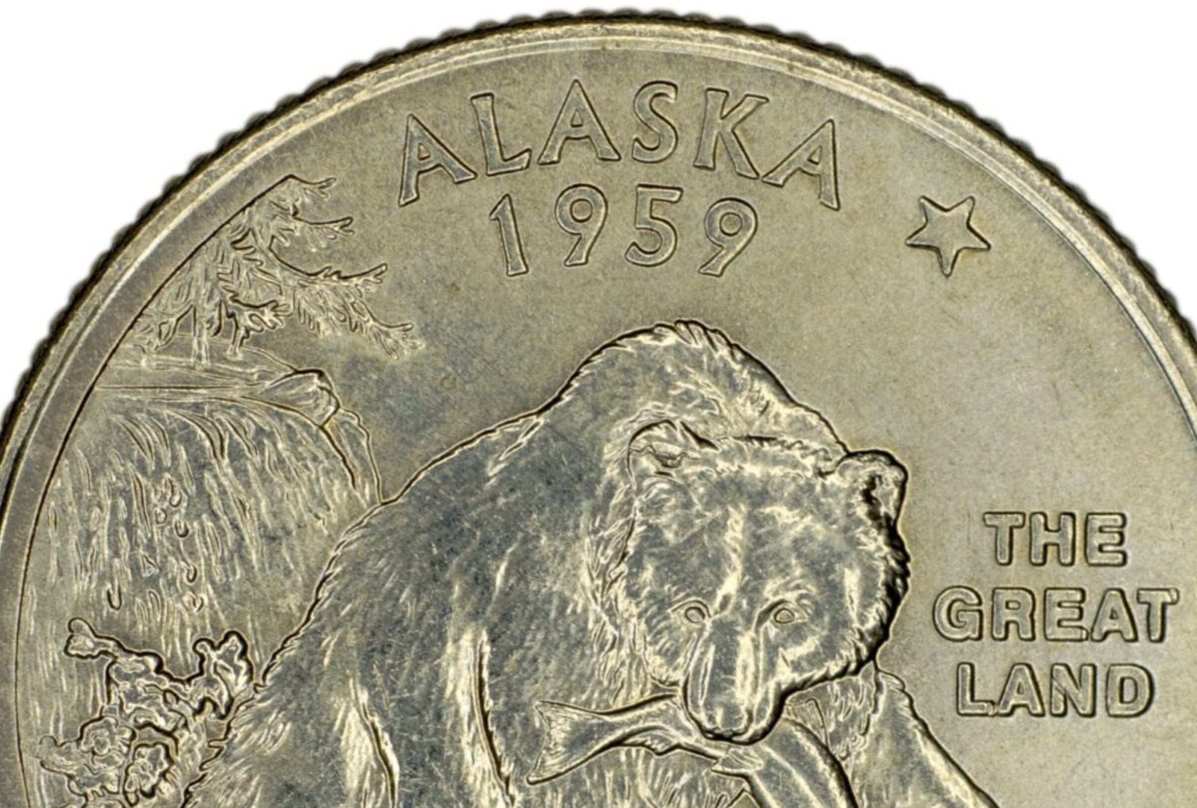 El reverso de la moneda de 25 centavos de Alaska muestra a un oso pardo emergiendo de un río (Foto: Freepik)