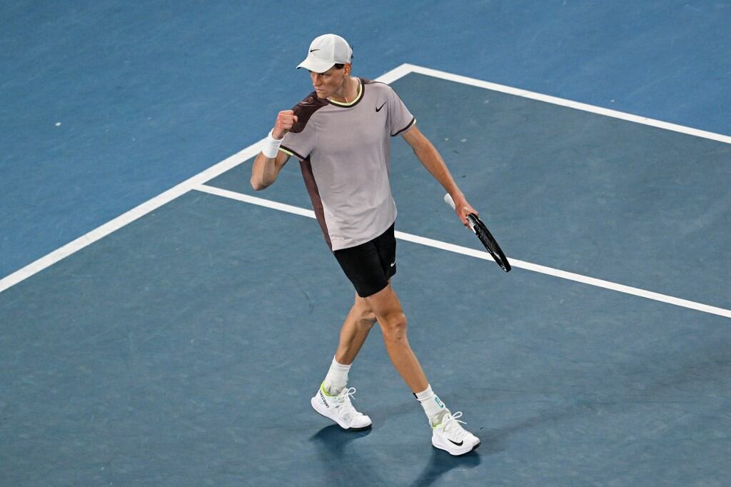 Italy's Jannik Sinner reacts after winning the 4th set against Russia's Daniil Medvedev during their men's singles final match on day 15 of the Australian Open tennis tournament in Melbourne on January 28, 2024. (Photo by Paul Crock / AFP) / -- IMAGE RESTRICTED TO EDITORIAL USE - STRICTLY NO COMMERCIAL USE --