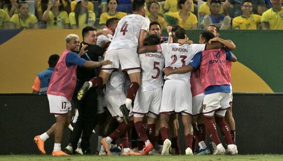 Venezuela's players celebrate scoring against Brazil during the 2026 FIFA World Cup South American qualification football match between Brazil and Venezuela at the Arena Pantanal stadium in Cuiaba, Mato Grosso State, Brazil, on October 12, 2023. (Photo by NELSON ALMEIDA / AFP)