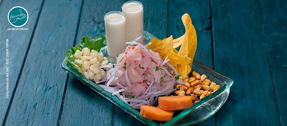 Visita Segundo Muelle y disfruta de los expertos en pescados y mariscos que ofrecen una amplia variedad de platos en su carta.