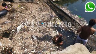 WhatsApp: niños nadan en laguna llena de basura en Huacho
