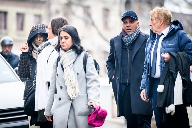 Namrata Hinduja (left) and Ajay Hinduja (second from right) arrive at the Geneva court with their lawyers.  (Photo by GABRIEL MONNET / AFP).