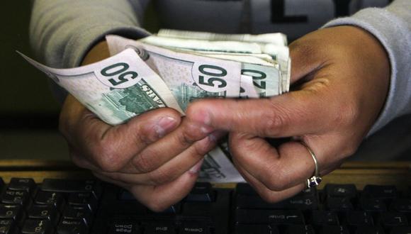 ¿Cuál es el precio del dólar en Chile? (Foto: AFP)