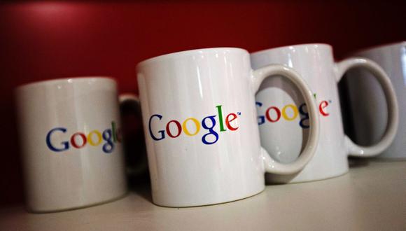 Coffee cups with Google logos are seen at the new Google office in Toronto, in this file photo taken November 13, 2012.   Google Inc's third-quarter revenue increased 20 percent, as a long-running decline in its online advertising rates showed signs of m