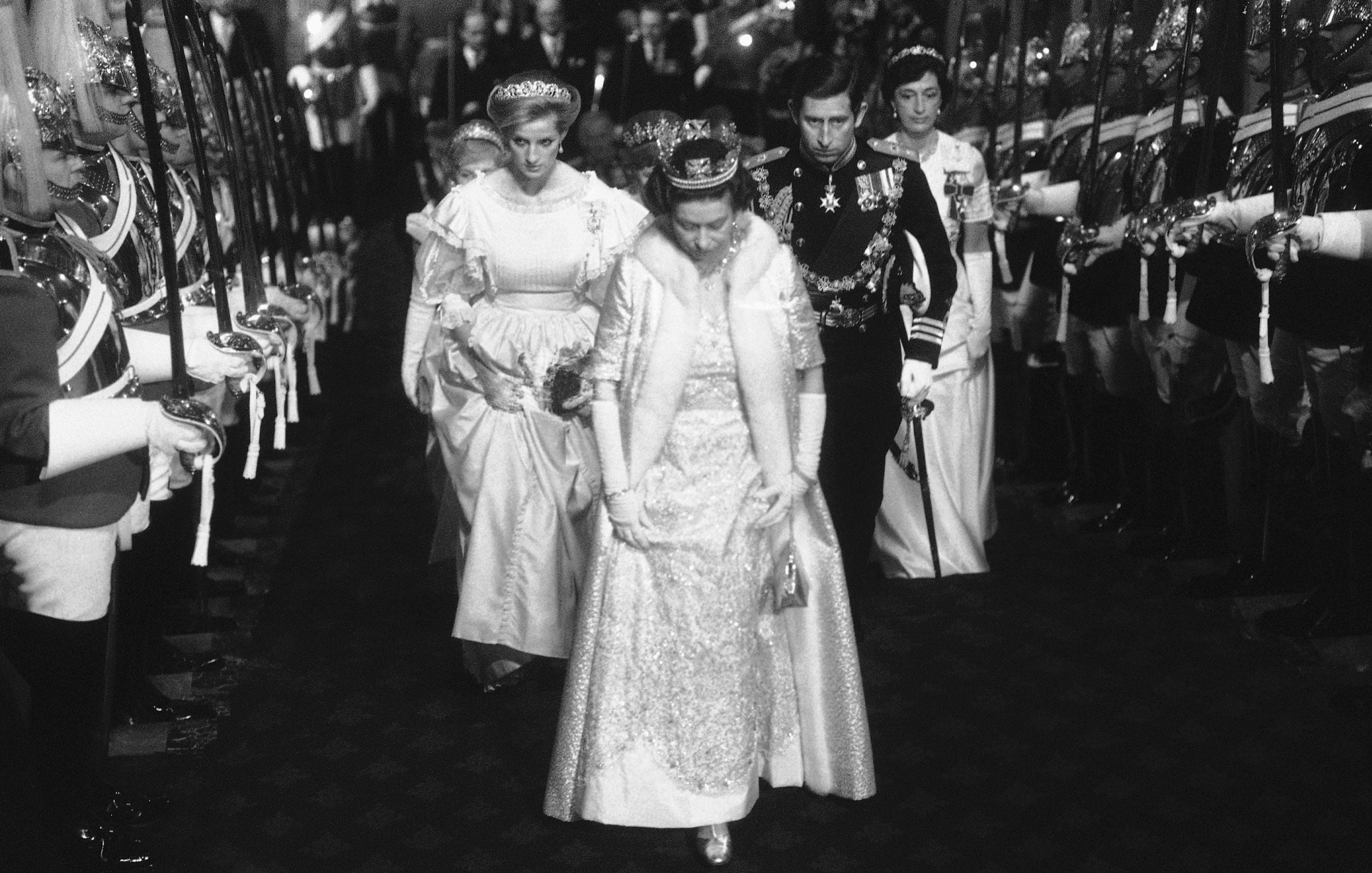 Queen Elizabeth II is followed by Princess Diana and Prince Charles on their way to Parliament in London, to celebrate the platinum jubilee of her accession to the throne.  AP