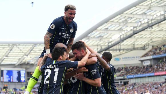 Una parte del grupo del Manchester City celebrando la remontada contra Brighton. (Foto: AP)