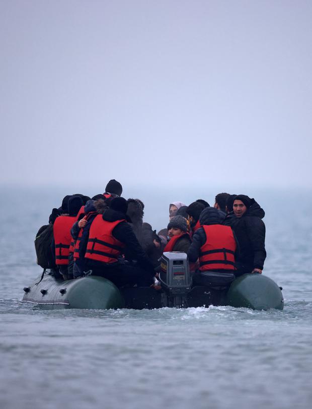 A group of more than 40 migrants in an inflatable boat leave the coast of northern France to cross the English Channel near Wimereux, France.  (REUTERS / Gonzalo Fuentes).