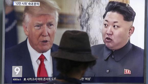 A man watches a television screen showing U.S. President Donald Trump, left, and North Korean leader Kim Jong Un during a news program at the Seoul Train Station in Seoul, South Korea, Thursday, Aug. 10, 2017. North Korea has announced a detailed plan to launch a salvo of ballistic missiles toward the U.S. Pacific territory of Guam, a major military hub and home to U.S. bombers. If carried out, it would be the North's most provocative missile launch to date. (AP Photo/Ahn Young-joon)