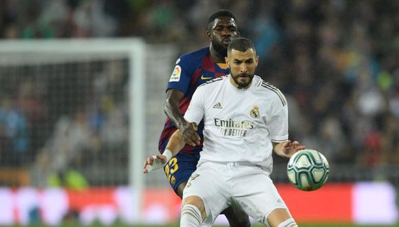 ¡A puro toque! Benzema y Vinícius Jr. se combinaron para crearle peligro al Barcelona | Foto: AFP
