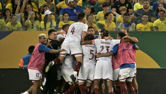 Venezuela's players celebrate scoring against Brazil during the 2026 FIFA World Cup South American qualification football match between Brazil and Venezuela at the Arena Pantanal stadium in Cuiaba, Mato Grosso State, Brazil, on October 12, 2023. (Photo by NELSON ALMEIDA / AFP)