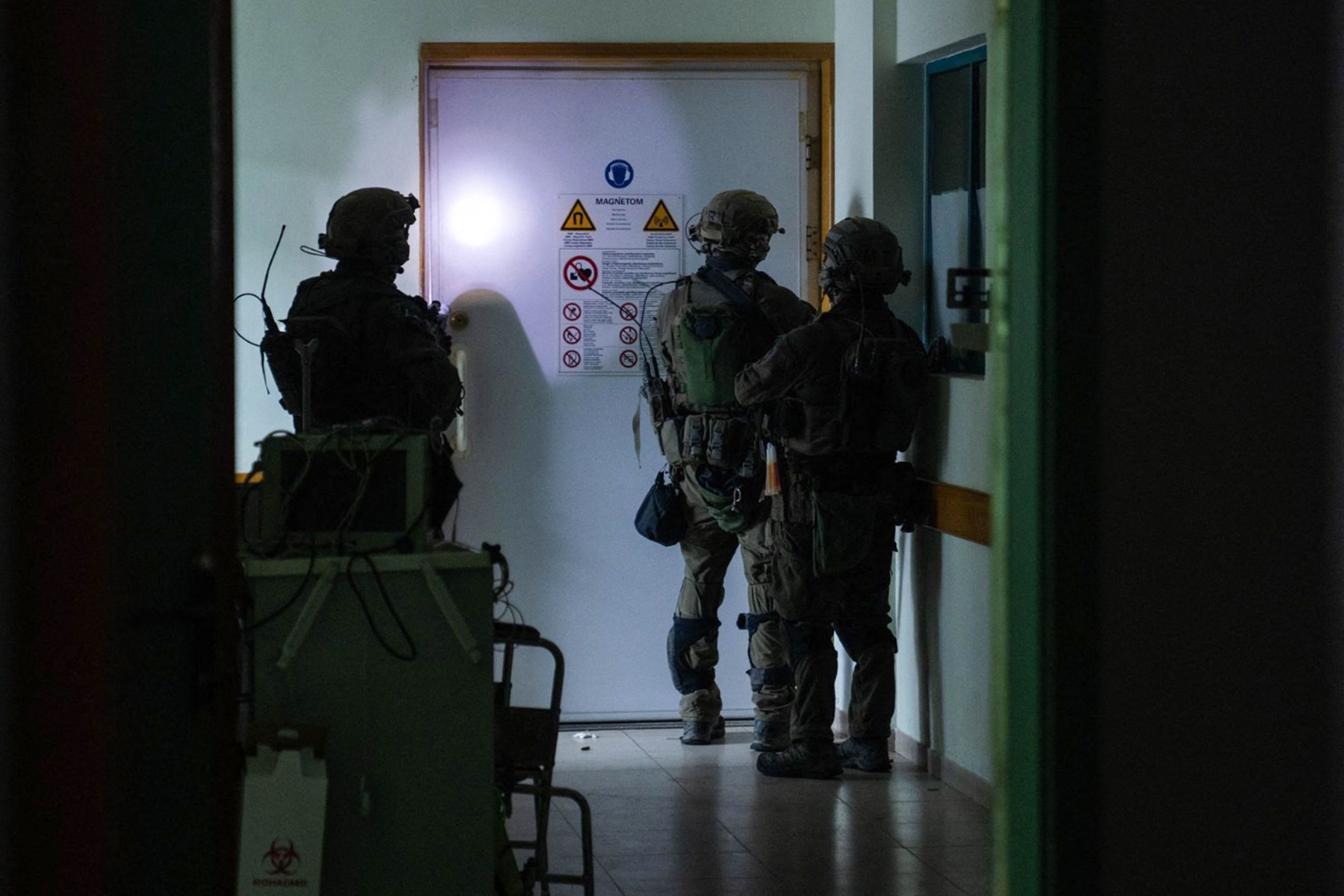 This photograph released by the Israeli military on November 15, 2023 shows Israeli soldiers carrying out operations inside Al Shifa hospital in Gaza City.  (AFP).