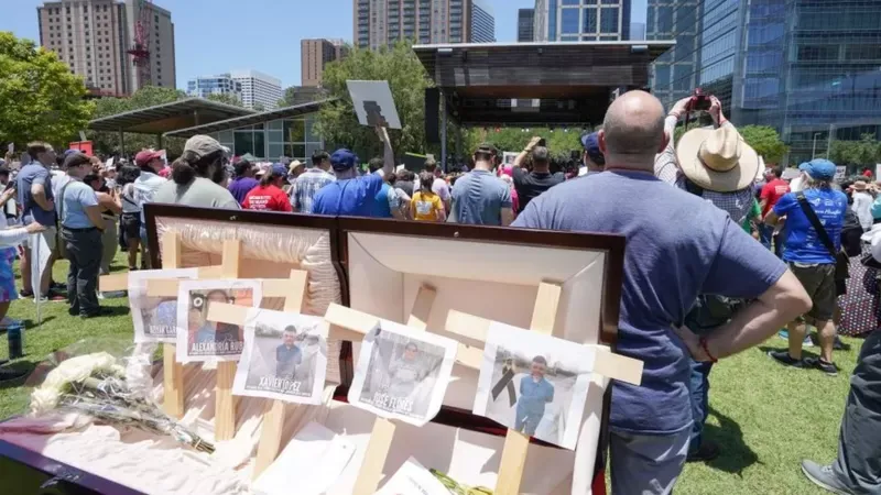 Protesters pay tribute to the victims of the shooting.  GETTY