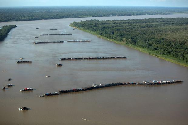 Photo published by Greenpeace showing mining vessels in the Madeira River, near the Rosarinho community, in Autazes, Amazonas state, Brazil, on November 23, 2021. (BRUNO KELLY / GREENPEACE / AFP).