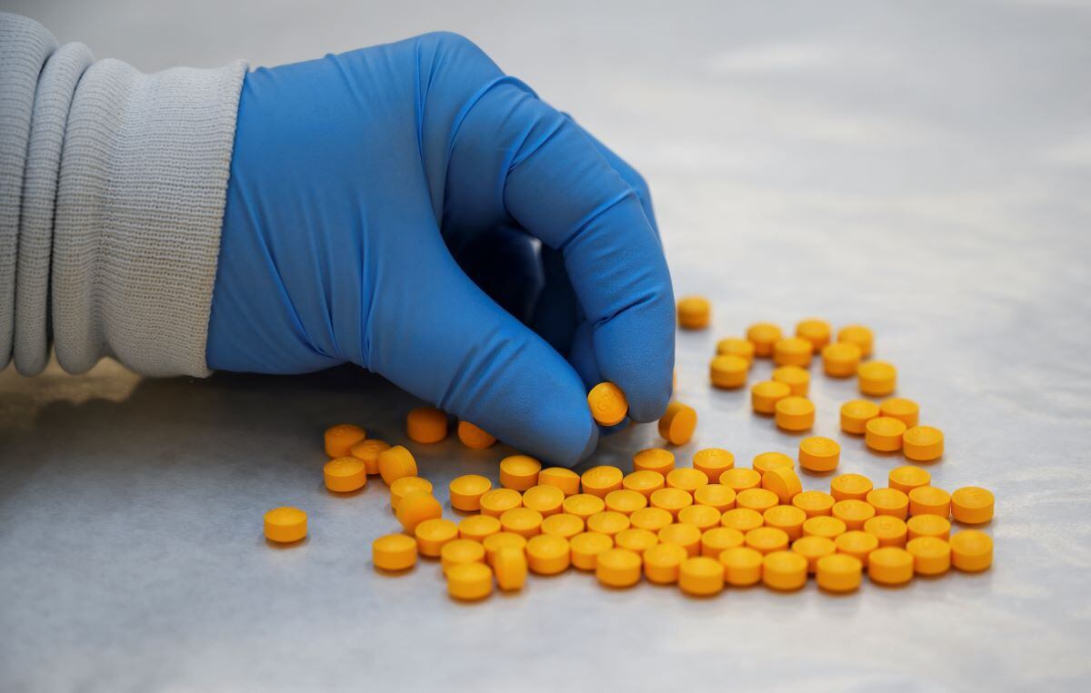 A DEA chemist reviews seized fentanyl on October 8, 2019, in New York.  (reference photo).