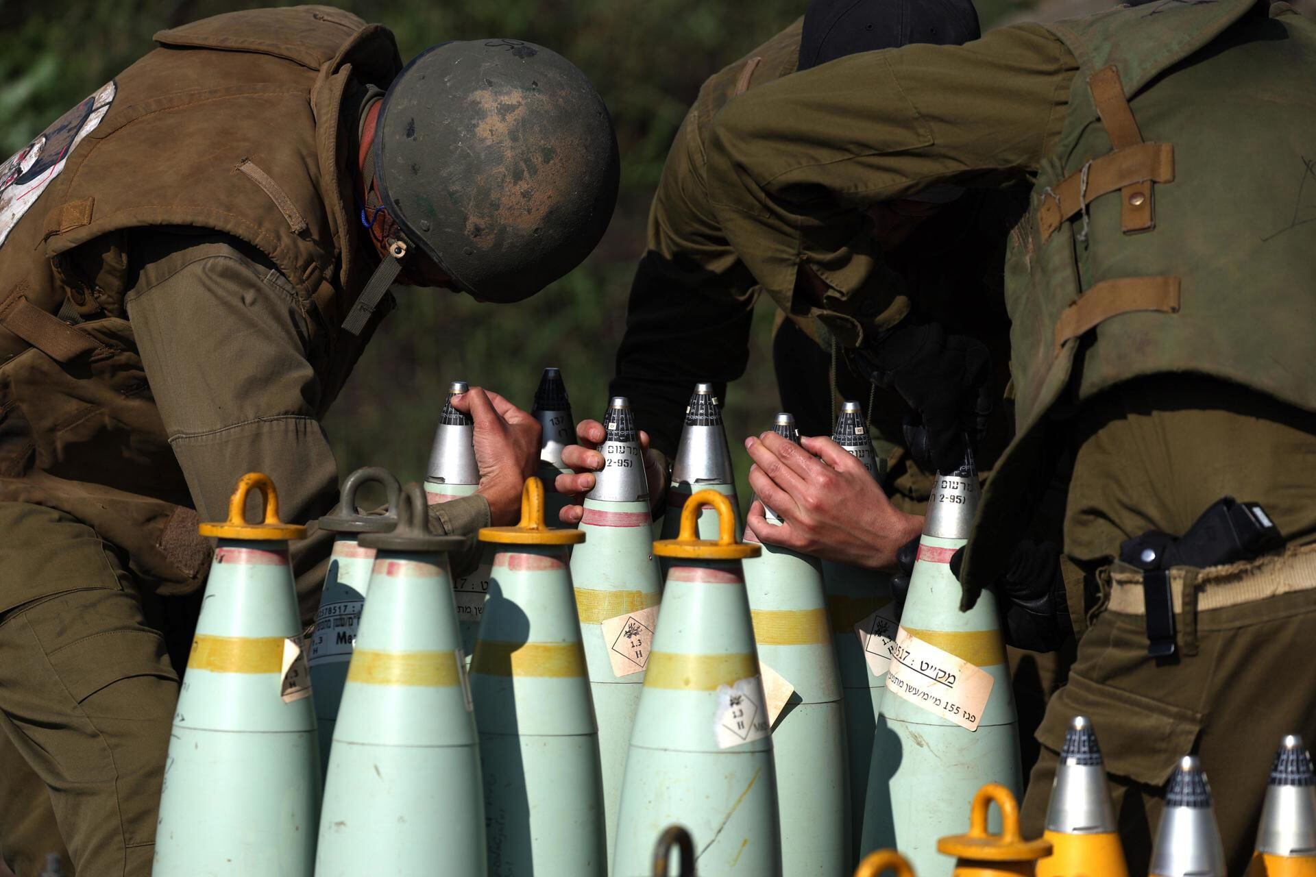 Israeli artillery unit prepares to fire at a target in Lebanon from an undisclosed location on the border, on January 4, 2024. (EFE/EPA/ATEF SAFADI).