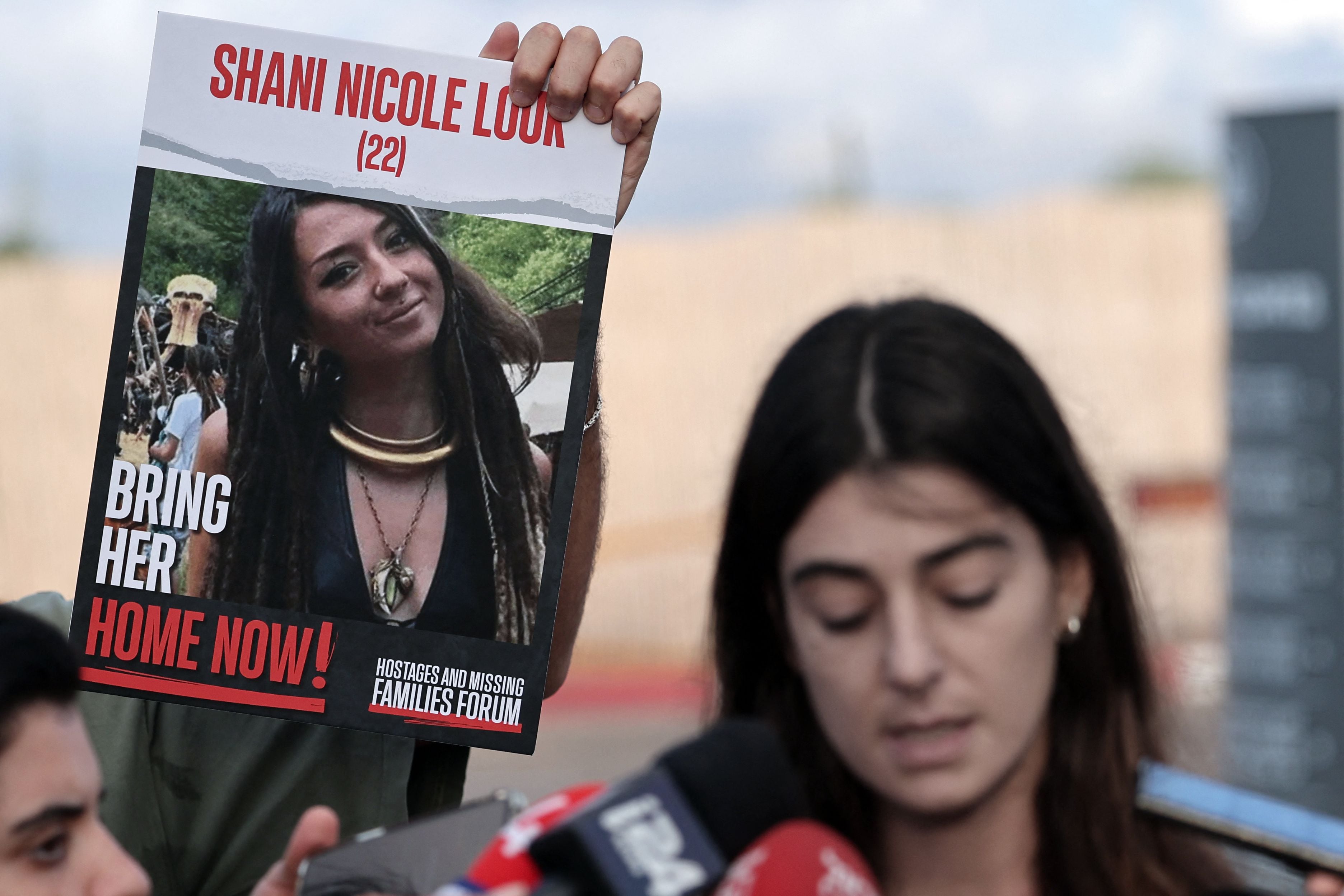 Hostage Shani's cousin, Nicole Louk, speaks to reporters after a meeting with Israeli Prime Minister Benjamin Netanyahu at the Ramla military base on October 15.  2023. (Photo by Thomas COEX/AFP).