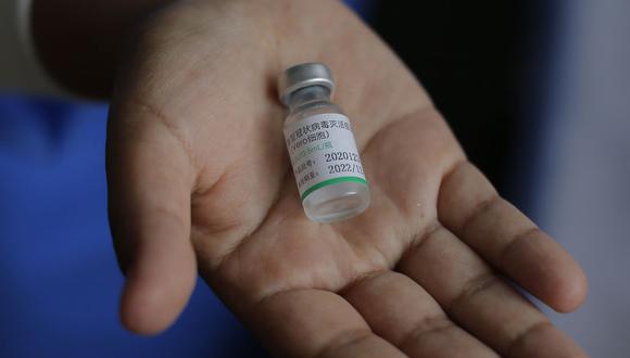 Comisión investigadora de las vacunaciones irregulares deberá entregar informe este jueves 25 de febrero. (Foto: Luka Gonzáles / AFP / Referencial)