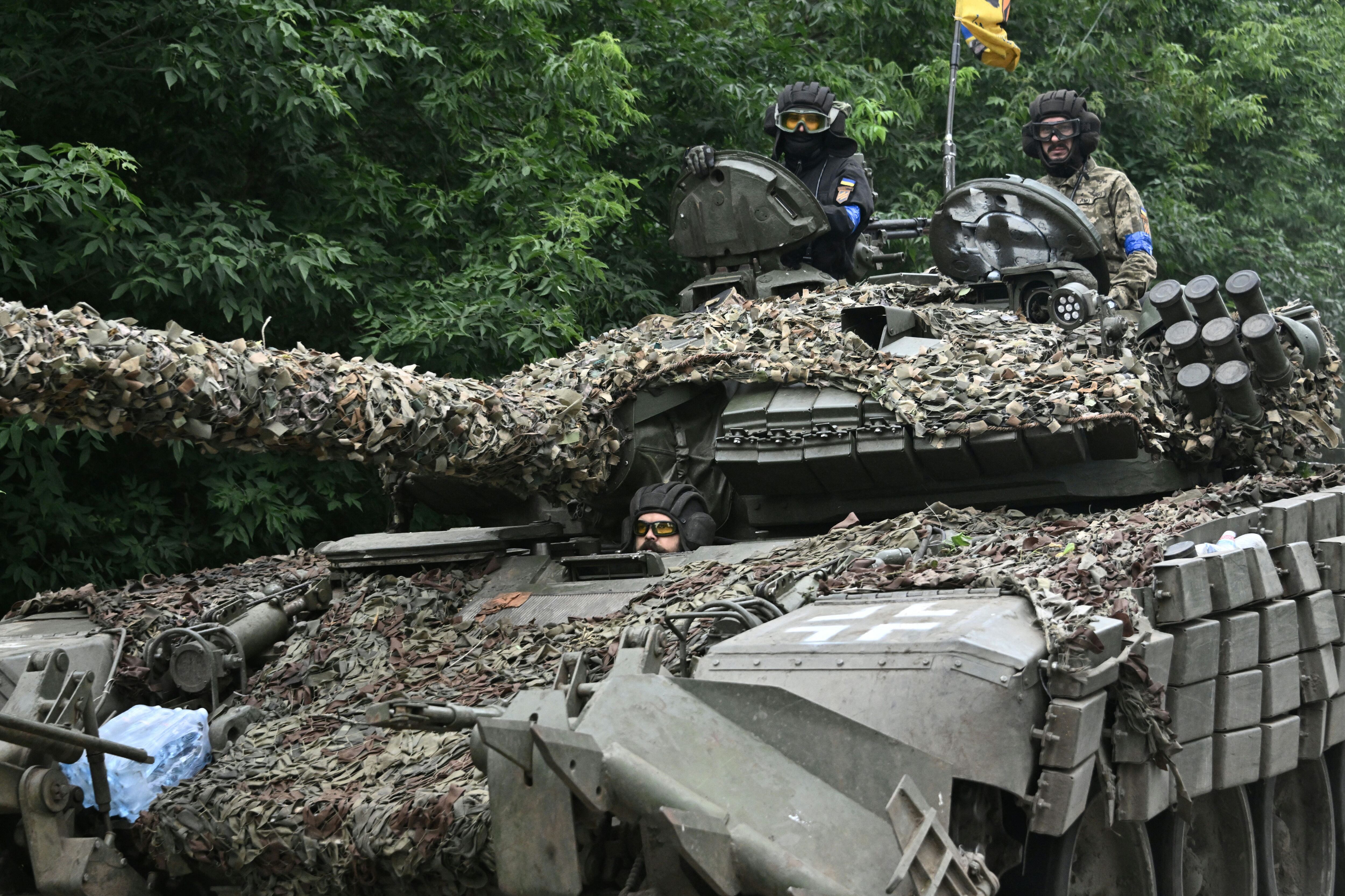 Ukrainian servicemen ride in a tank in the Donetsk region on June 28, 2023, amid Russia's invasion of Ukraine.  (Photo by Genya SAVILOV / AFP).
